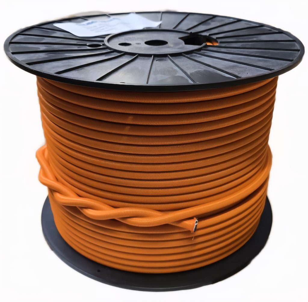 Oranges Gummiseil auf Spule aufgewickelt als Meterware für Industrie und Befestigungstechnik